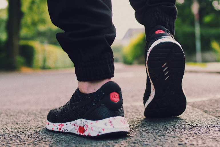 Person in Black Sneakers Walking on Street More info Share