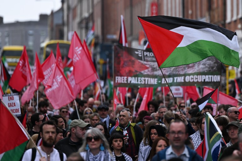 DUBLIN, IRELAND - MAY 18: Pro-Palestinian activists from the Ireland Palestine Solaidarity Campaign, supported by members of left-wing parties including People Before Profit and the Socialist Party and students, participate in the 'National March for Palestine' from the Garden of Remembrance to O'Connell Street and Leinster House, on May 18, 2024, in Dublin, Ireland. (Photo by Artur Widak/NurPhoto via Getty Images)