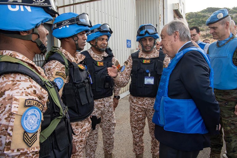 This handout picture provided by the United Nations Interim Forces in Lebanon (UNIFIL), shows UN Secretary-General Antonio Guterres (2-R), accompanied by UNIFIL Head of Mission and Force Commander General Aroldo Lazaro Saenz (R), meeting with peacekeeping soldiers at the forces' headquarters in Naqura in southern Lebanon near the Israeli border on January 17, 2025. Guterres on January 17 urged an end to Israel's "continued occupation" and "military operations" in south Lebanon, after a November ceasefire to end fighting between Israel and militant group Hezbollah. (Photo by Pascual Gorriz / UNIFIL / AFP) / === RESTRICTED TO EDITORIAL USE - MANDATORY CREDIT "AFP PHOTO / HO / UNIFIL" - NO MARKETING - NO ADVERTISING CAMPAIGNS - DISTRIBUTED AS A SERVICE TO CLIENTS ===