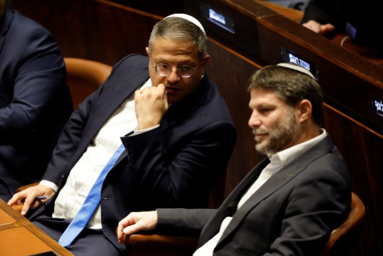 إيتمار بن غفير و بتسلئيل سموتريش Right-wing Knesset members Itamar Ben-Gvir and Bezalel Smotrich attend a special session at the Knesset Israel's parliament, to approve and swear in a new right-wing government, in Jerusalem December 29, 2022. REUTERS/Amir Cohen/Pool