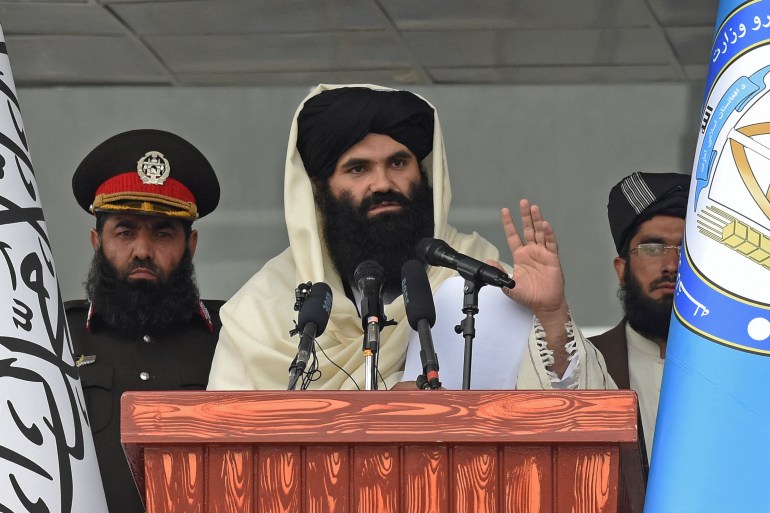 Taliban Interior Minister Sirajuddin Haqqani speaks to new Afghan police recruits during a graduation ceremony at the police academy in Kabul on March 5, 2022. (Photo by Wakil KOHSAR / AFP)