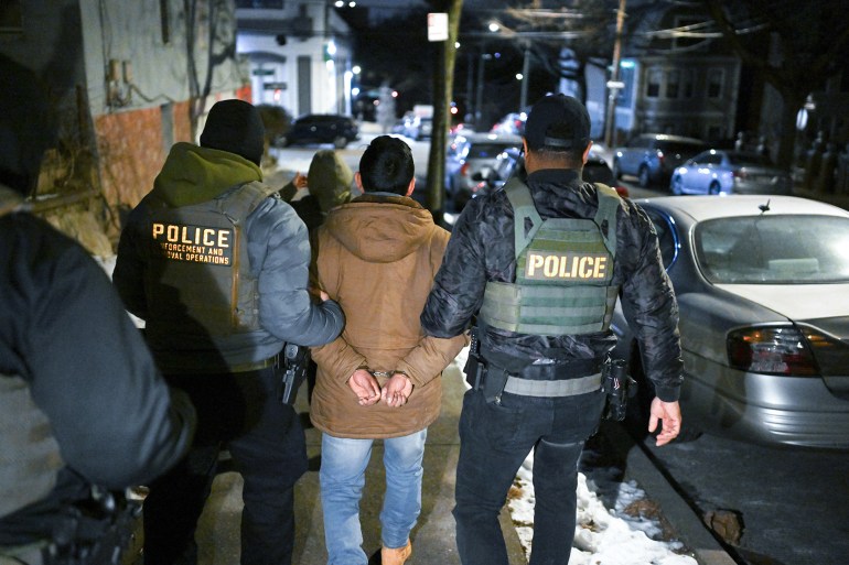 NEW YORK, NY - JANUARY 28: Law enforcement walk with Leonardo Fabian Cando Juntamay as he was detained in the Bronx during ICE led operations to apprehend illegal immigrants on Tuesday January 28, 2025 in New York, NY. (Photo by Matt McClain/The Washington Post via Getty Images)