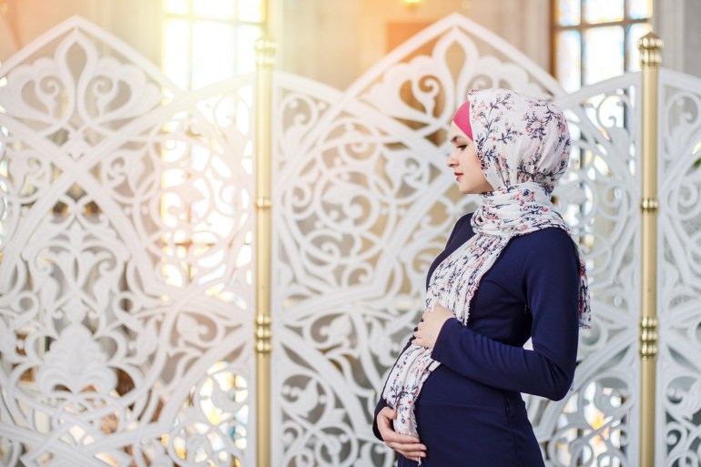 pregnant woman in a hijab; Shutterstock ID 424004896; purchase_order: aj; job: ; client: ; other: