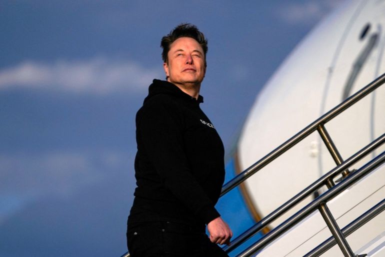 Tesla CEO Elon Musk boards Air Force One with U.S. President Donald Trump (not pictured) as they departs for Philadelphia, Pennsylvania, from Morristown Municipal Airport in Morristown, New Jersey, U.S., March 22, 2025. REUTERS/Nathan Howard TPX IMAGES OF THE DAY