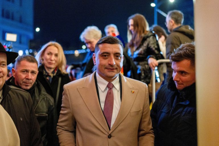 FILE PHOTO: The leader of the radical right Alliance for Uniting Romanians (AUR) party, George Simion, looks on following initial exit polls at the party?s campaign headquarters on the day of the parliamentary election, in Bucharest, Romania, December 1, 2024. REUTERS/Alkis Konstantinidis/File Photo