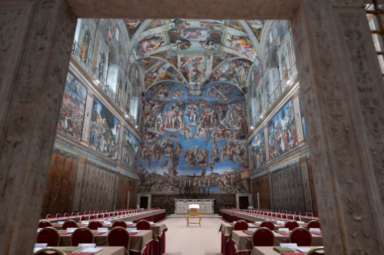 TOPSHOT - This photo taken and handout on May 6, 2025 by The Vatican Media shows the Sistine Chapel on the eve of the conclave in The Vatican. (Photo by Handout / VATICAN MEDIA / AFP) / RESTRICTED TO EDITORIAL USE - MANDATORY CREDIT "AFP PHOTO / VATICAN MEDIA" - NO MARKETING - NO ADVERTISING CAMPAIGNS - DISTRIBUTED AS A SERVICE TO CLIENTS