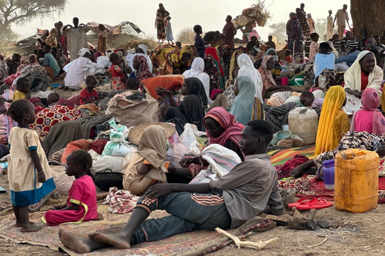 (FILES) People who fled the Zamzam camp for the internally displaced after it fell under RSF control, rest in a makeshift encampment in an open field near the town of Tawila in war-torn Sudan's western Darfur region on April 13, 2025.