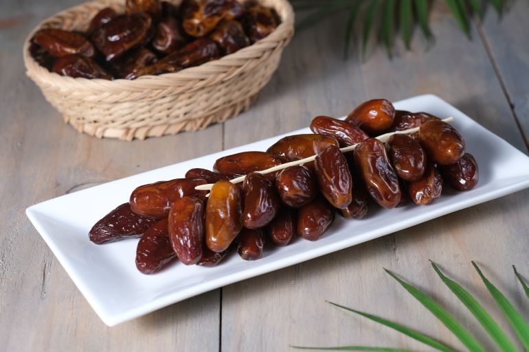 تقرير التمر المشترك - التمور في تونس Closeup delicious Kurma Tunisia or sweet dried date palm fruits on white plate. Much sought after during Ramadan to break the fast. ; Shutterstock ID 1948219048;