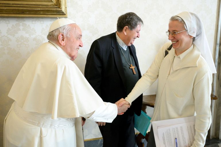 Sister Simona Brambilla, 59, who became the first woman named by Pope Francis to lead a major Vatican department on January 6, 2025, shakes hand with Pope Francis in this undated picture released by Vatican Media/Handout via REUTERS ATTENTION EDITORS - THIS IMAGE WAS PROVIDED BY A THIRD PARTY