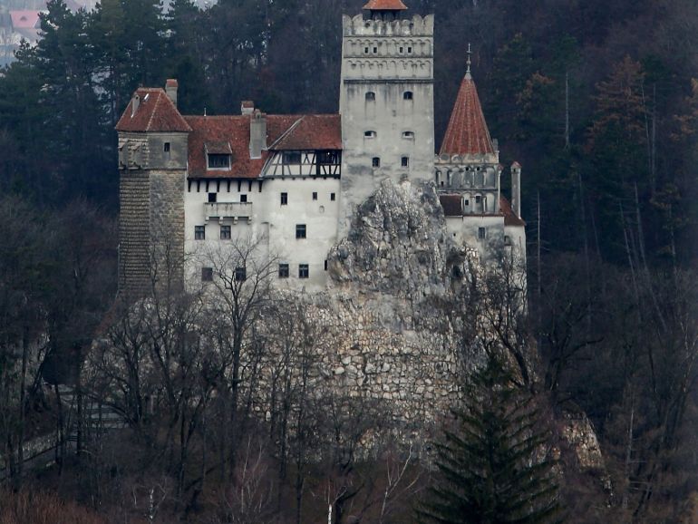 BRAN, ROMANIA - MARCH 10: Bran Castle, famous as 'Dracula's Castle,' stands among Transylvanian mountains on March 10, 2013 in Bran, Romania. Bran Castle's reputation as the supposed home to Dracula corresponds little with Bram Stoker's novel, nor did Vlad Tepes, the sadistic 15th-century Wallachian prince, ever live there. Nevetheless the castle retains the myth and tourists flock there in large numbers. Bran Castle, along with the mountainous region of southern Transylvania, which is home to Saxon fortified towns and churches, are among the asssets the Romanian government hopes will bring increasing numbers of tourists to the country. Both Romania and Bulgaria have been members of the European Union since 2007 and restrictions on their citizens' right to work within the EU are scheduled to end by the end of this year. However Germany's interior minister announced recently that he would veto the two countries' entry into the Schengen Agreement, which would not affect labour rights but would prevent passport-free travel. (Photo by Sean Gallup/Getty Images)