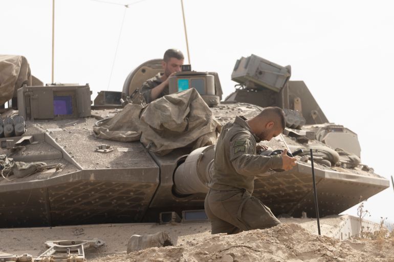 SOUTHERN ISRAEL, ISRAEL - MAY 19: Israeli soldiers work on a tank cannon near the border with the Gaza Strip on May 19, 2025 in Southern Israel, Israel. The Israeli military has said its expanding ground operations in Gaza as part of what they're calling 'Operation Gideon's Chariots,' aimed at securing the release of hostages still held in Gaza, as well as "the defeat of Hamas." Israel has been escalating its campaign in Gaza and blockade of humanitarian aid after the previous two-month long ceasefire agreement collapsed in March. Meanwhile, over the weekend the two sides reportedly began indirect talks to reach a ceasefire in Doha, the capital of Qatar. (Photo by Amir Levy/Getty Images)