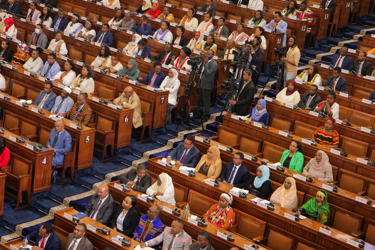 Members of the Ethiopian parliament listen to Prime Minister Abiy Ahmed as he addresses the current situation of the country at the parliament building in Addis Ababa, Ethiopia, March 20, 2025. REUTERS/Tiksa Negeri