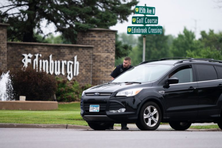 BROOKLYN PARK, MINNESOTA - JUNE 14: A Brooklyn Park police officer speaks with the driver of a vehicle entering a neighborhood on June 14, 2025 in Brooklyn Park, Minnesota. Democratic-Farmer-Labor State Rep. Melissa Hortman and her husband were shot and killed this morning. Democratic-Farmer-Labor State Sen. John Hoffman and his wife were also shot and hospitalized in a separate incident. Minnesota Gov. Tim Walz said during a press conference that the shooting "appears to be a politically motivated assassination." Stephen Maturen/Getty Images/AFP (Photo by Stephen Maturen / GETTY IMAGES NORTH AMERICA / Getty Images via AFP)