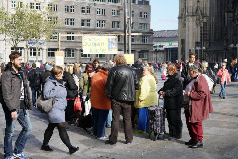 COLOGNE, GERMANY - OCTOBER 23, 2015: distribution of food to the homeless in the center of Cologne in Germany