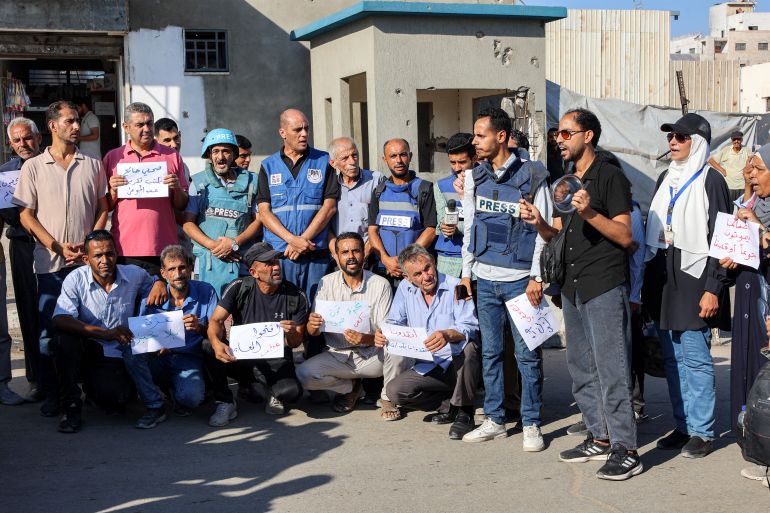Demonstrators and journalists gather to protest against hunger in the Rimal district of Gaza City on July 19, 2025.