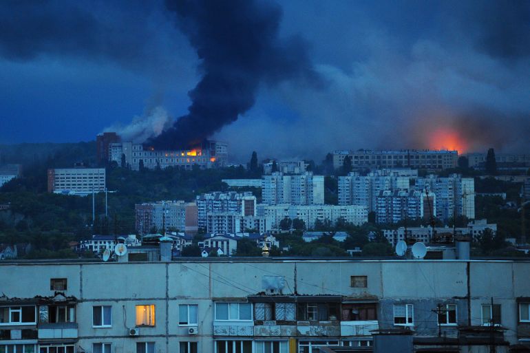 Fire and smoke rise from the site where a Russian missile struck a residential area in Kharkiv, Ukraine, Saturday, June 7, 2025, (AP Photo/Anatolii Lysianskyi)