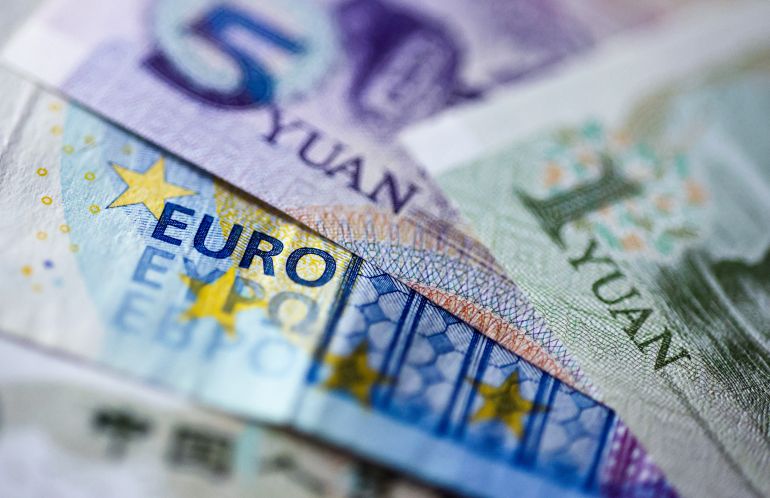 epa12255452 Euro and Yuan banknotes in Berlin, Germany, 23 July 2025. According to a study published by the German Economic Insitute on 23 July, China's undervaluation of the yuan is driving the eurozone's trade deficit. The German Economic Institute presented the study "Yuan Undervaluation against the Euro: Unfair Cost Advantages for China?!". EPA/HANNIBAL HANSCHKE